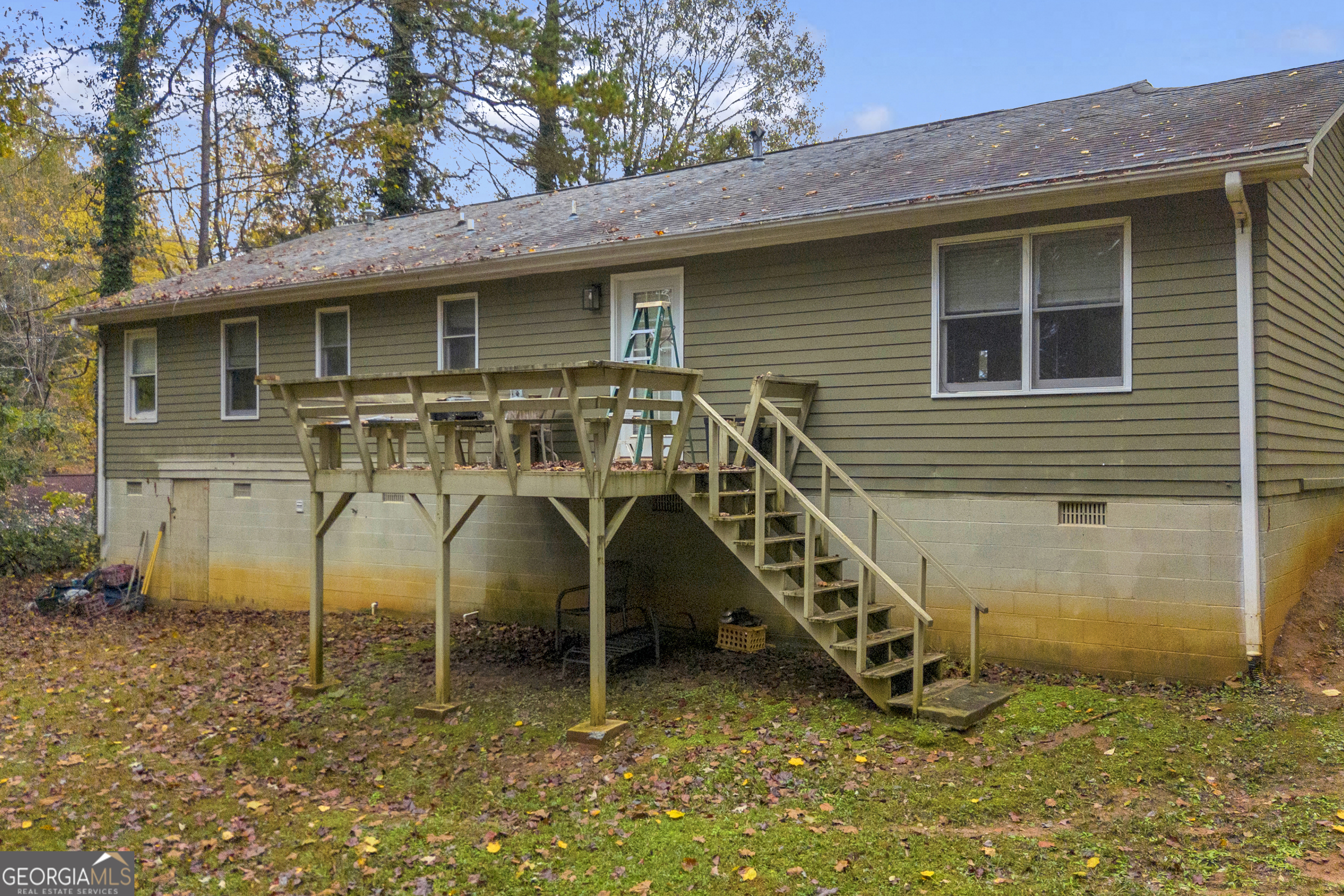 619 Watson Street Toccoa, GA 30577 - Photo 9 of 28 a view of a house with large windows and a yard