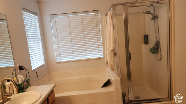 5948 Inheritance Court Taylorsville, UT 84123 - Photo 20 of 30 Primary Bathroom - Integrated bathtub and enclosed shower with a glass door