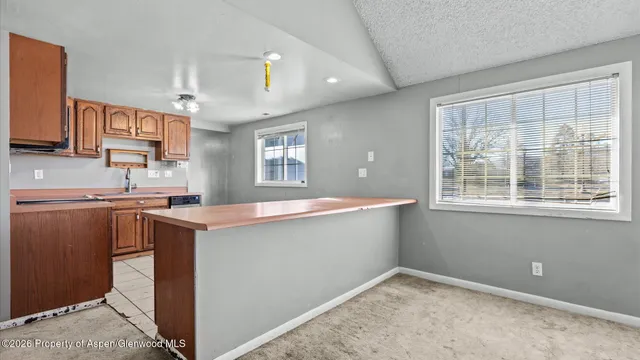 a bathroom with a toilet a sink and a mirror