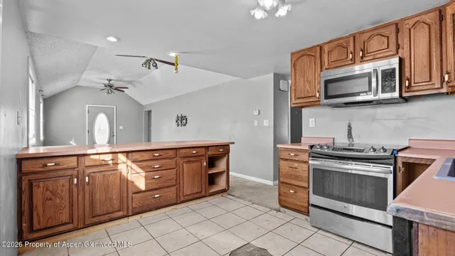 a bathroom with a sink toilet a mirror and shower