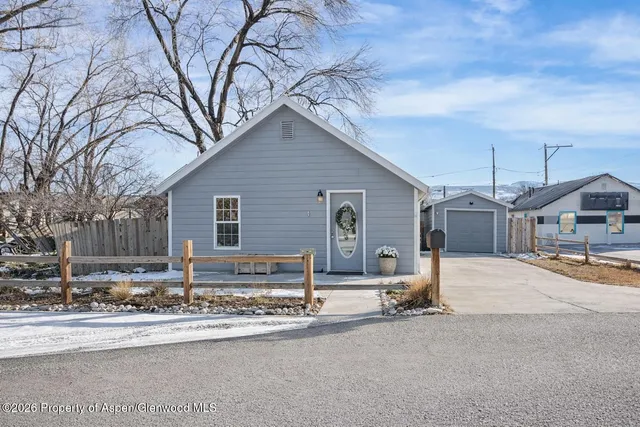 a kitchen with stainless steel appliances a sink stove and refrigerator