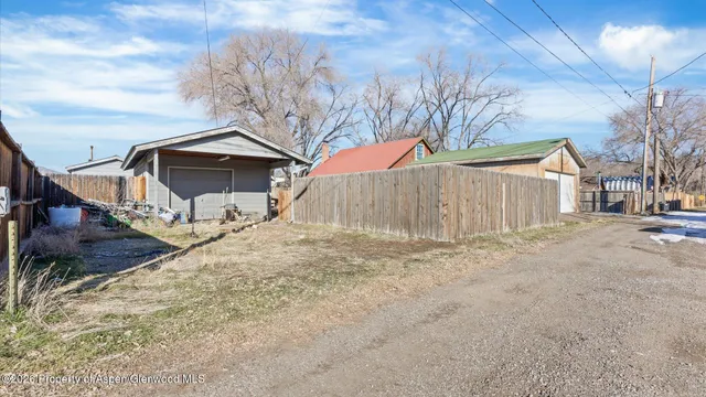 a kitchen with a stove a sink and a window