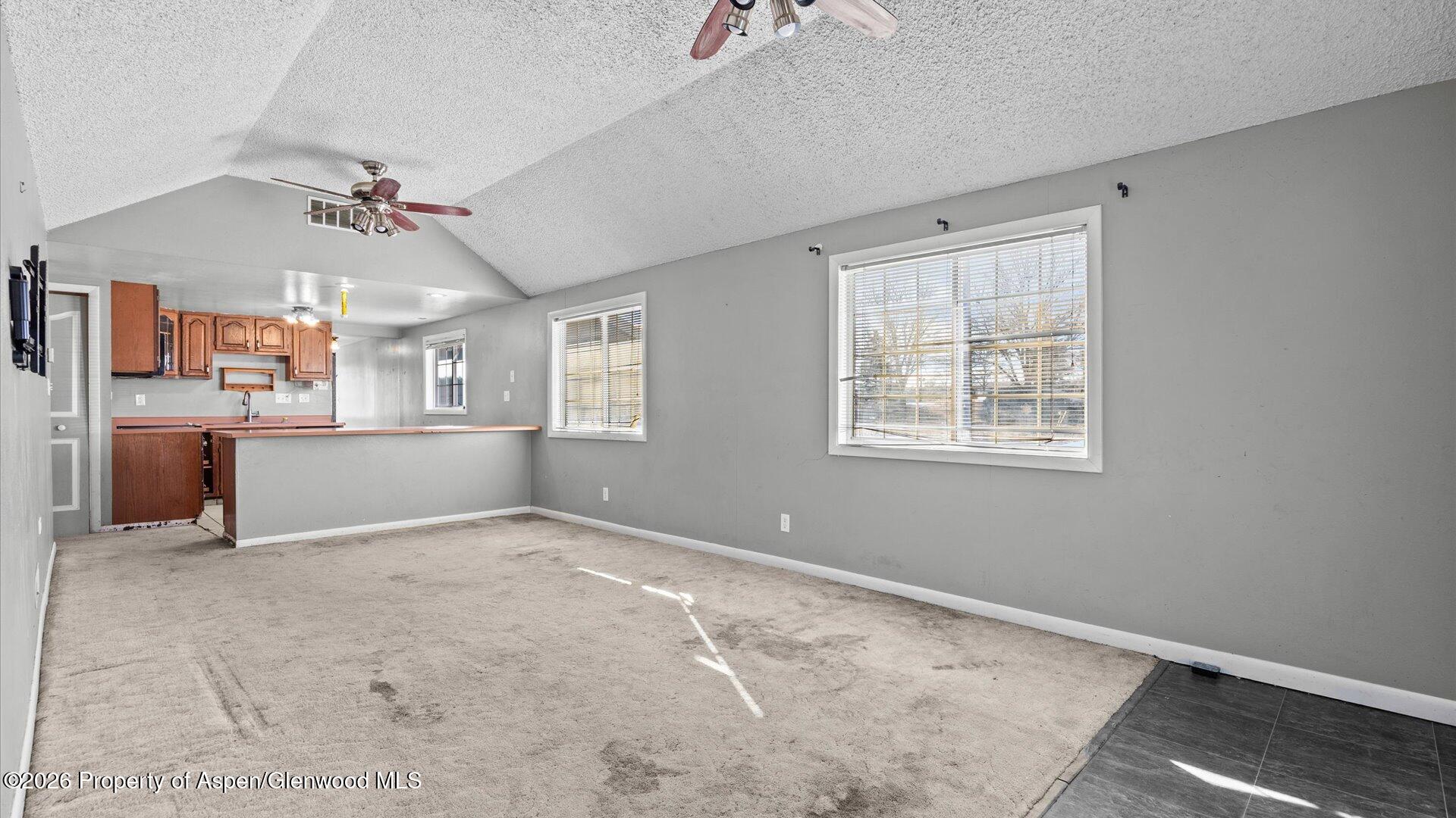 109 East 12th Street Rifle, CO 81650 - Photo 7 of 31 wooden floor in an empty room with a window