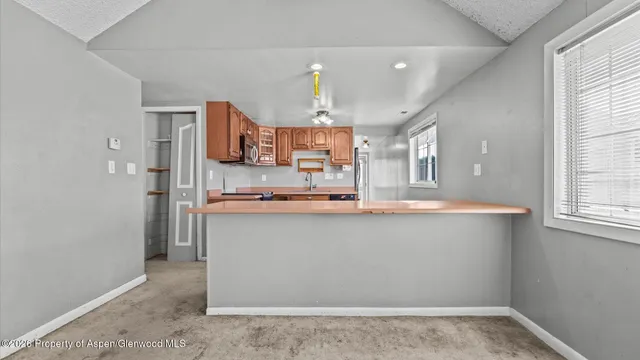 a view of an empty room with a window