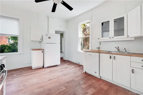 a view of a kitchen with electric appliances