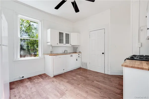 a view of a kitchen with electric appliances