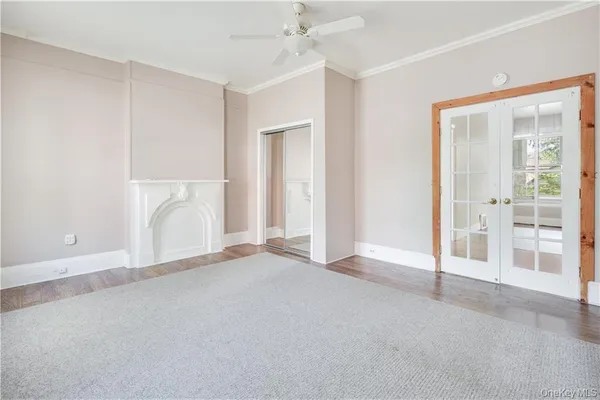an empty room with a fireplace and a shower