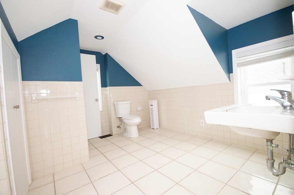 21 Carnes Street Lynn, MA 01905 - Photo 17 of 20 a bathroom with a sink and a mirror