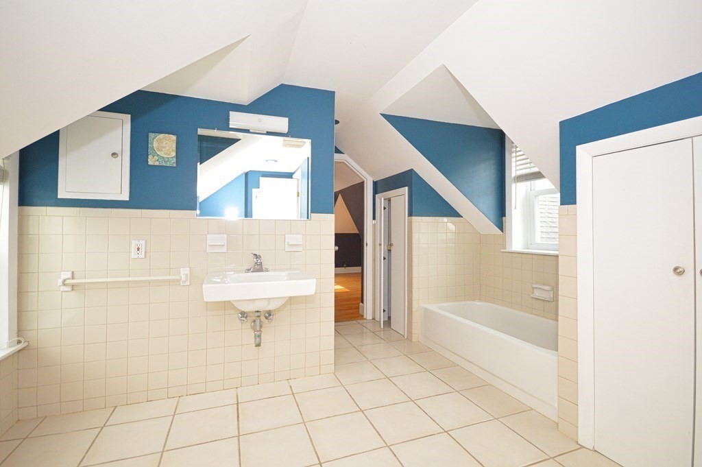 21 Carnes Street Lynn, MA 01905 - Photo 18 of 20 a bathroom with a bathtub and a sink