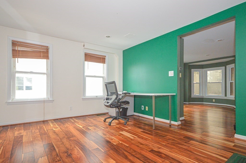 21 Carnes Street Lynn, MA 01905 - Photo 2 of 20 a view of a room with wooden floor and windows