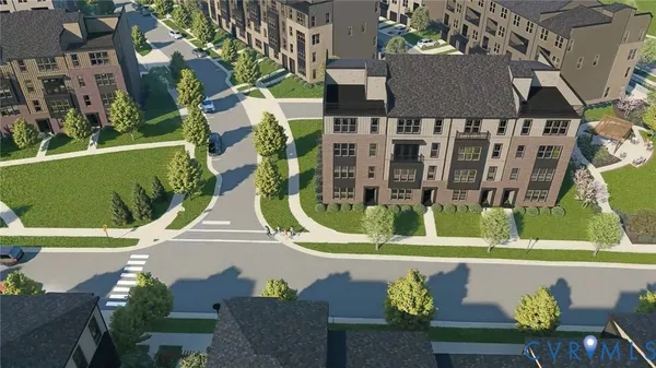 an aerial view of multiple houses with a yard