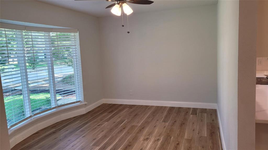 13124 Kerr Trail Farmers Branch, TX 75244 - Photo 14 of 30 a view of a room with wooden floor and windows