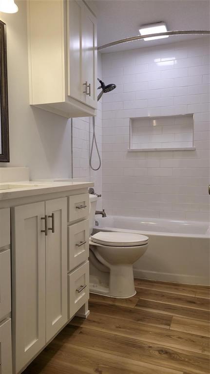 13124 Kerr Trail Farmers Branch, TX 75244 - Photo 16 of 30 a bathroom with a toilet a sink and mirror