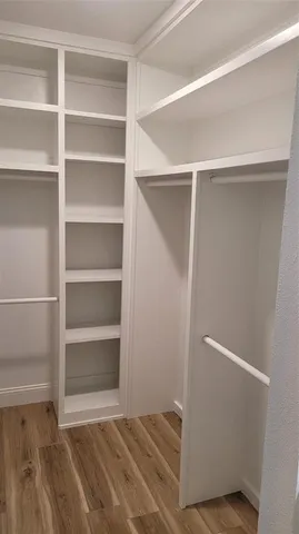 a view of an empty walk in closet