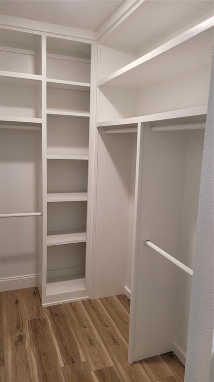 13124 Kerr Trail Farmers Branch, TX 75244 - Photo 19 of 30 a view of an empty walk in closet