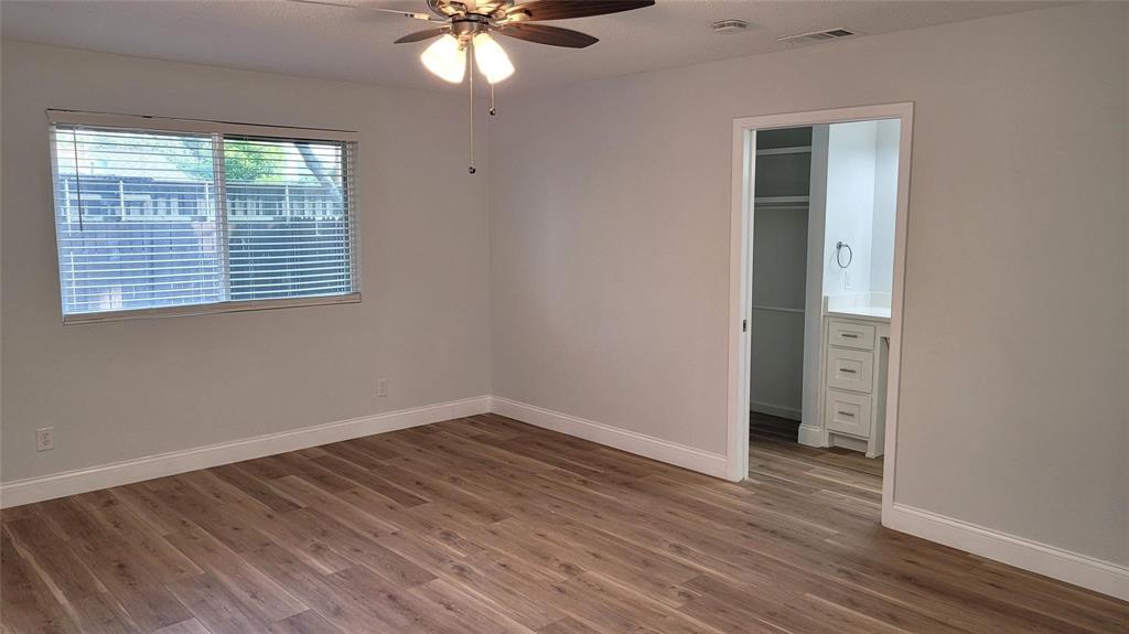 13124 Kerr Trail Farmers Branch, TX 75244 - Photo 20 of 30 a view of an empty room with wooden floor and a window