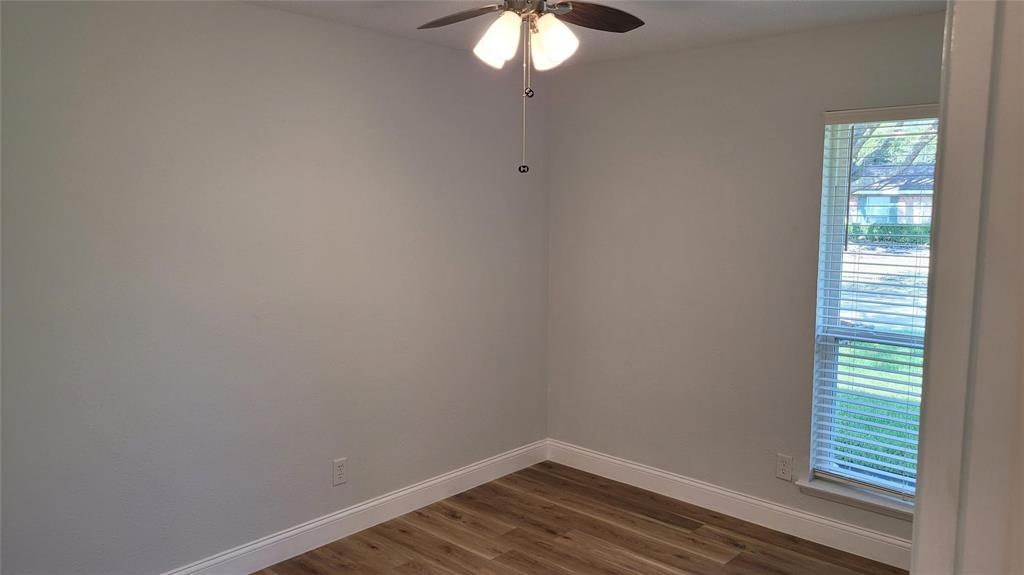 13124 Kerr Trail Farmers Branch, TX 75244 - Photo 23 of 30 a view of a small space with wooden floor and a window