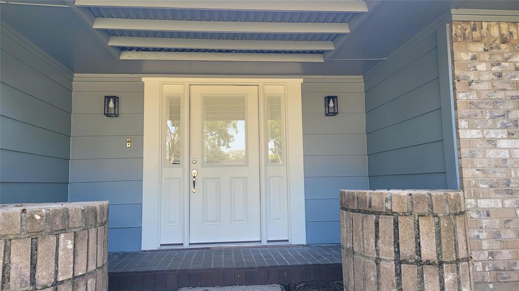 13124 Kerr Trail Farmers Branch, TX 75244 - Photo 4 of 30 a view of a door and wooden floor in a bathroom