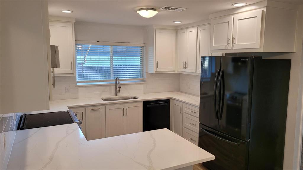 13124 Kerr Trail Farmers Branch, TX 75244 - Photo 8 of 30 a kitchen with a refrigerator and window