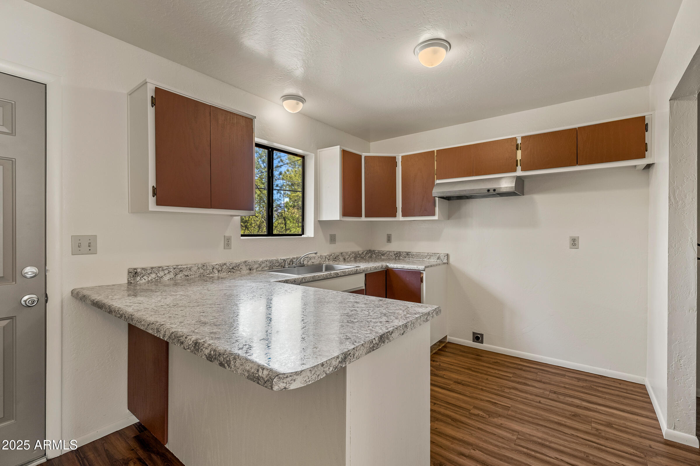 108 East Paseo Del Rio Flagstaff, AZ 86001 - Photo 14 of 26 a kitchen with a sink and cabinets