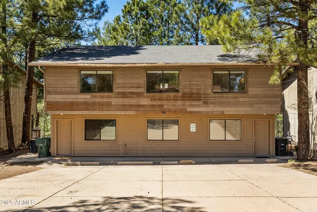 a front view of a house with garage