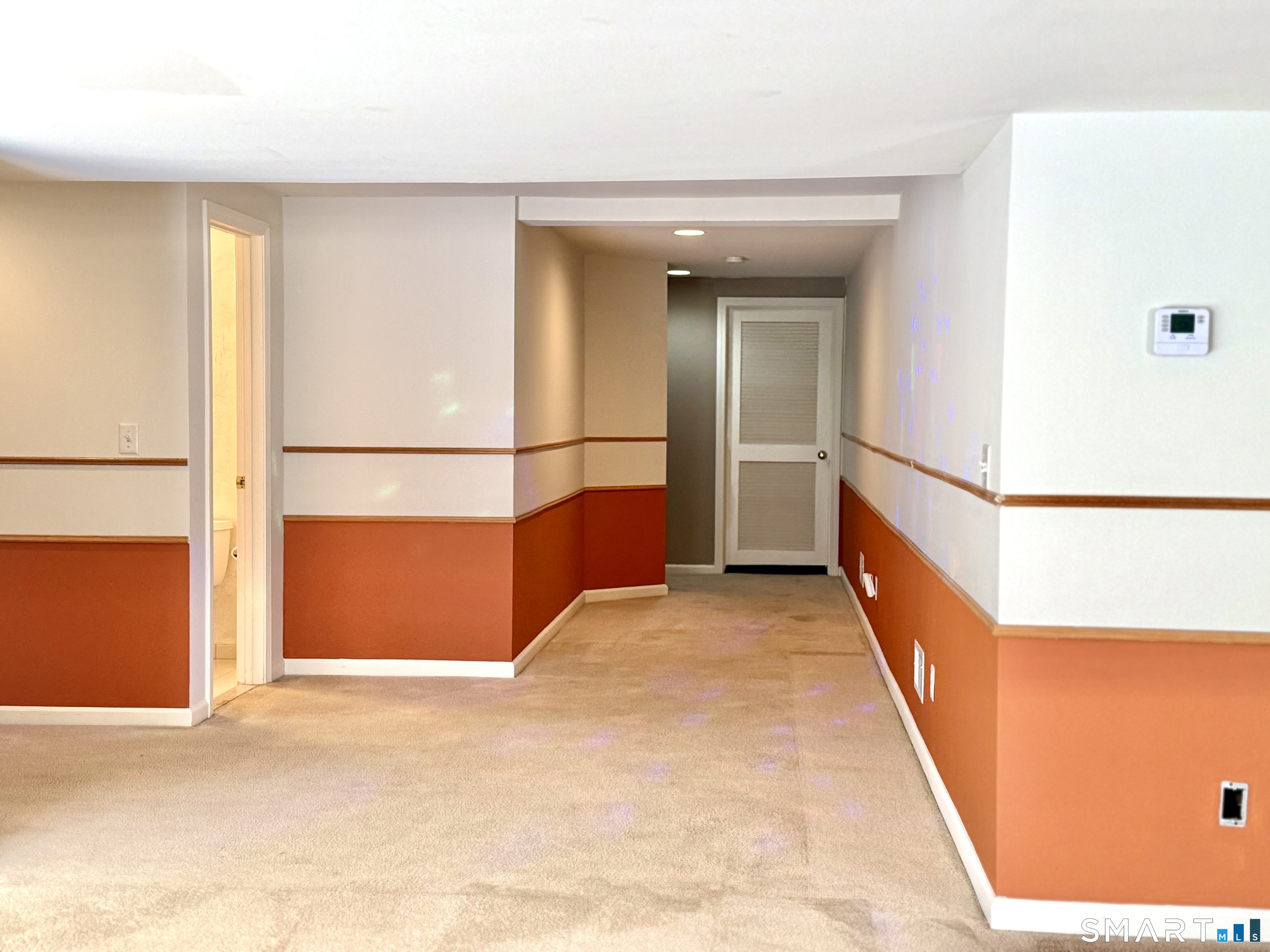 3 Brookside Drive, Unit 3 Middlebury, CT 06762 - Photo 30 of 38 a view of a hallway with a large window