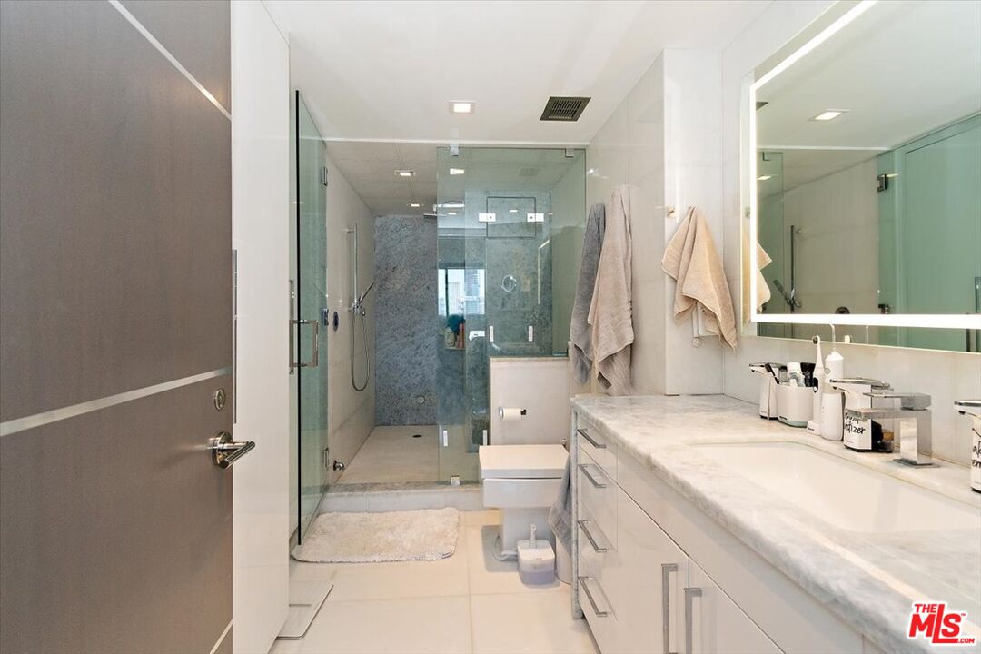2222 Avenue Of The Stars, Unit 1203 Los Angeles, CA 90067 - Photo 18 of 43 a bathroom with a double vanity sink mirror and shower