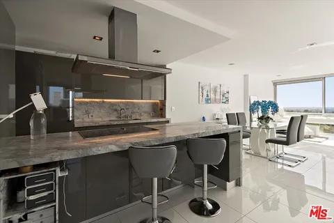 a kitchen with a table and chairs in it