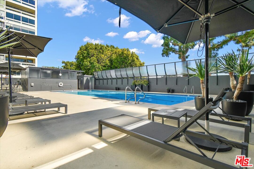 2222 Avenue Of The Stars, Unit 1203 Los Angeles, CA 90067 - Photo 25 of 43 a view of a chairs and table in the patio