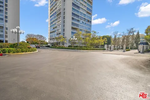 a view of a street with a building in the background