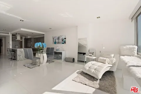 a view of a living room and dining room