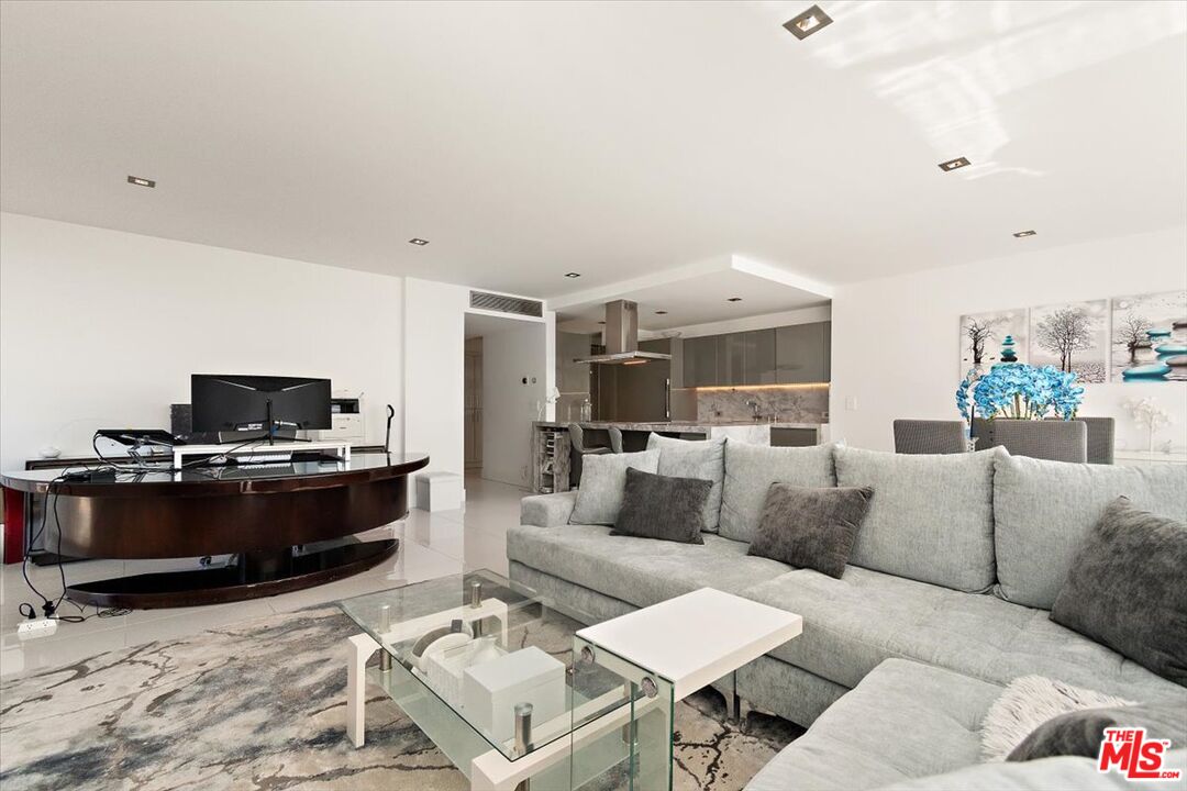 2222 Avenue Of The Stars, Unit 1203 Los Angeles, CA 90067 - Photo 41 of 43 a living room with furniture and a flat screen tv