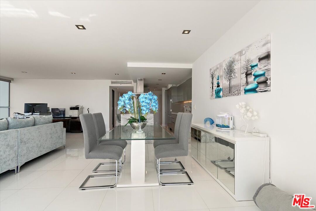 2222 Avenue Of The Stars, Unit 1203 Los Angeles, CA 90067 - Photo 8 of 43 a living room with furniture and a chandelier