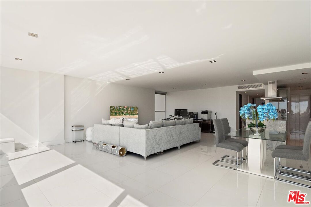 2222 Avenue Of The Stars, Unit 1203 Los Angeles, CA 90067 - Photo 9 of 43 a living room with furniture and white walls