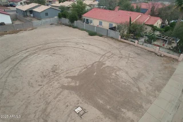a view of a house with a yard and garage