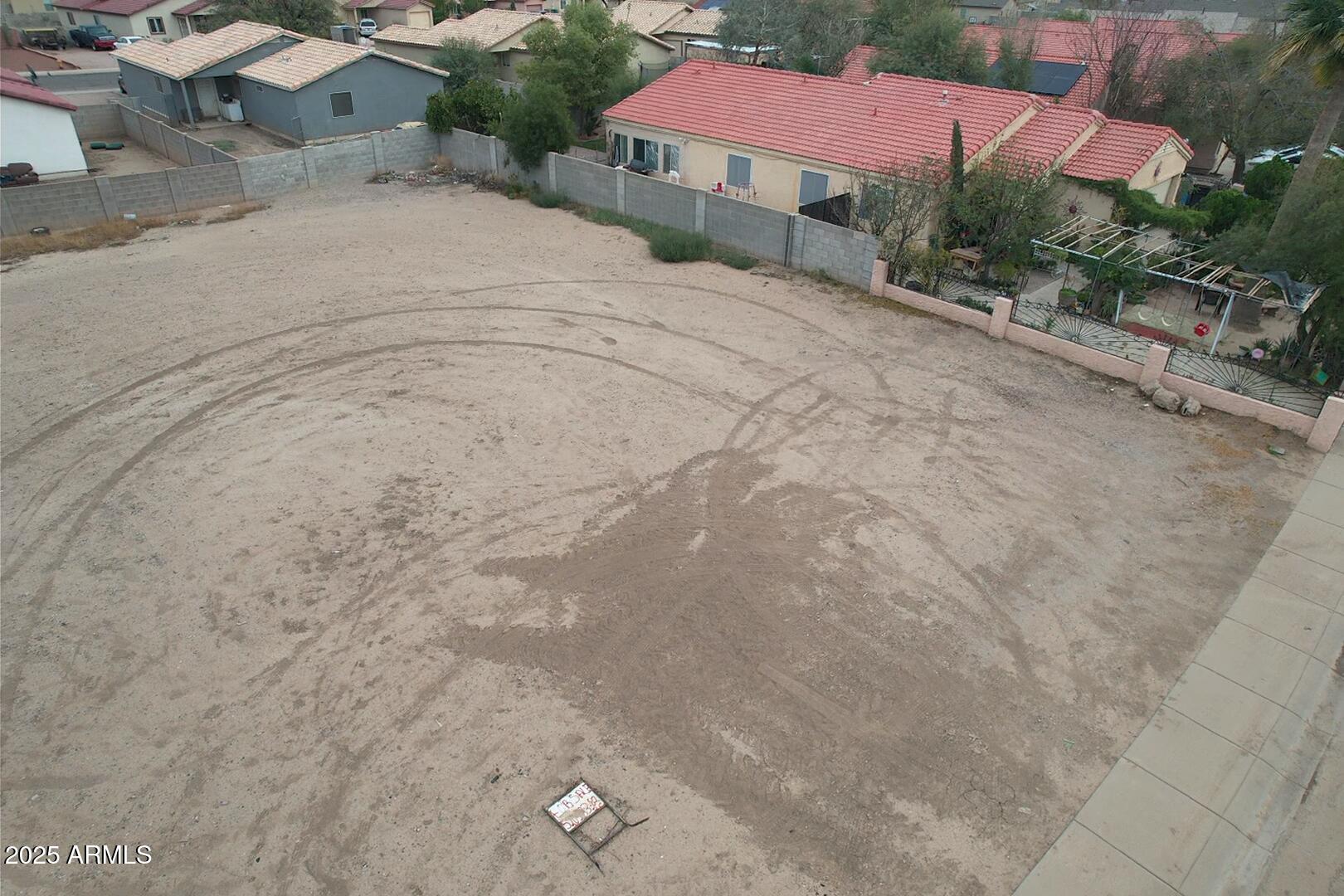 153 South Picacho Heights Road, Unit 79 Eloy, AZ 85131 - Photo 2 of 4 a view of a house with a yard and garage