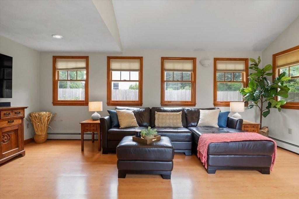 23 Old Post Road East Walpole, MA 02032 - Photo 13 of 27 a living room with furniture and a large window