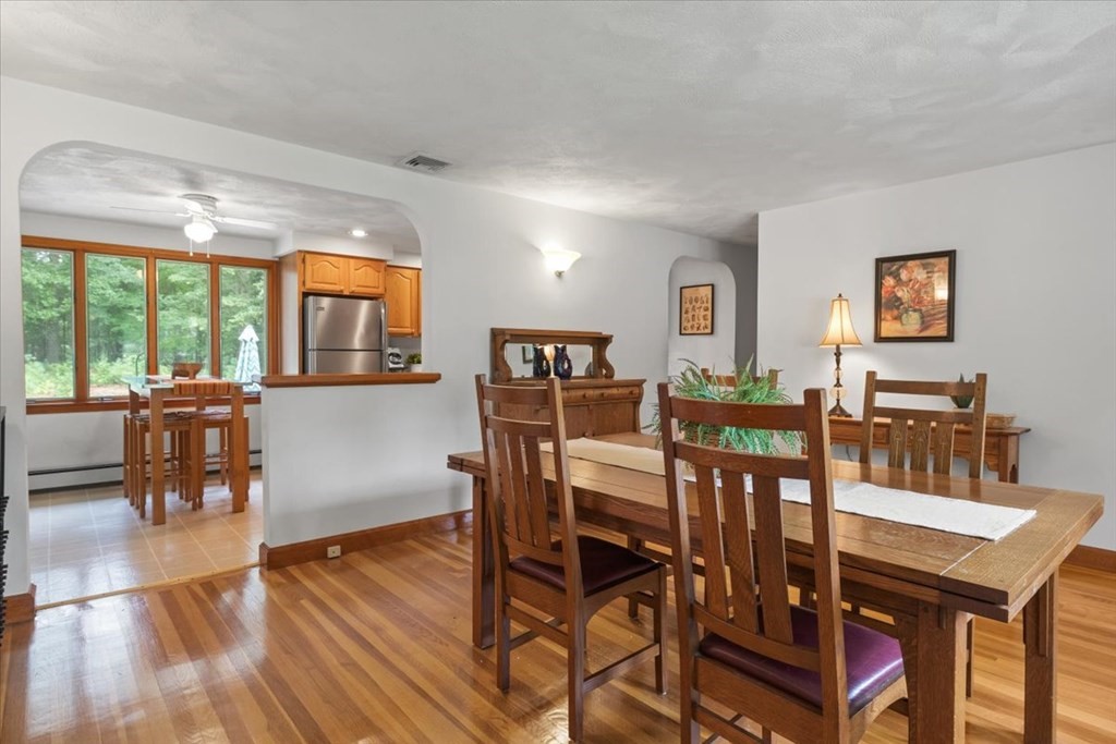 23 Old Post Road East Walpole, MA 02032 - Photo 4 of 27 a view of a dining room with furniture and wooden floor