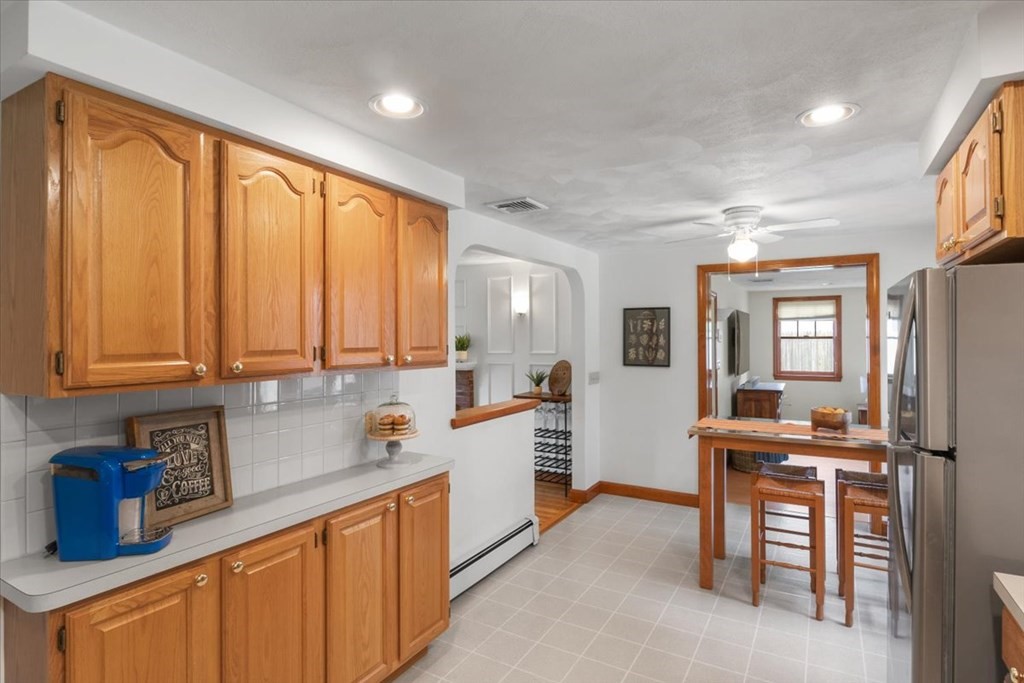 23 Old Post Road East Walpole, MA 02032 - Photo 6 of 27 a kitchen with a sink stove and cabinets