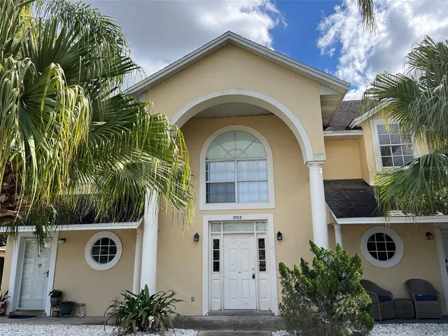 a view of a house with a small garden