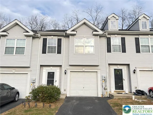 a view of a white house with a large windows