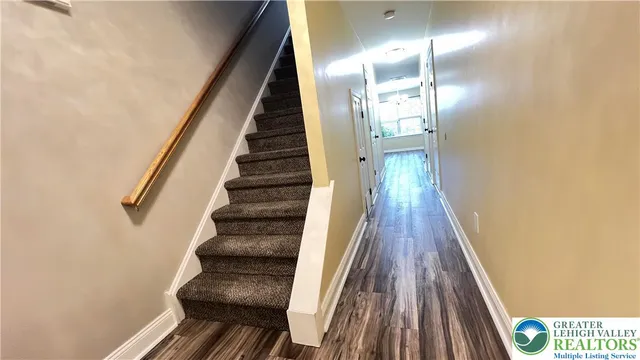 a view of entryway with wooden floor