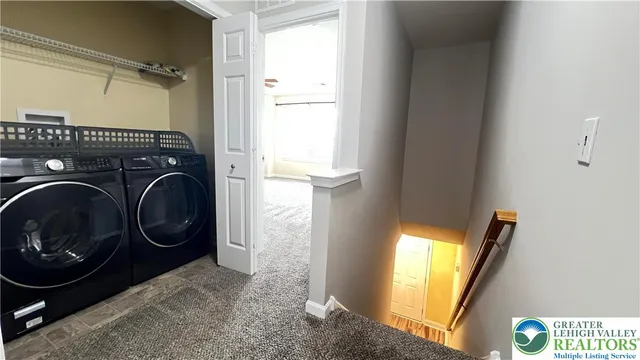 an entryway of a room with wooden floor and windows