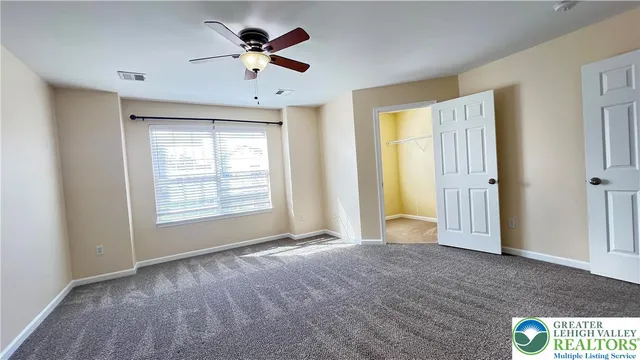 a view of a small space with racks on the wall