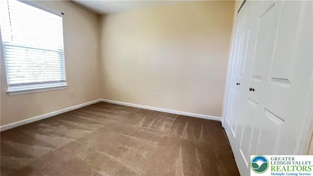 a bathroom with a sink a toilet and a large mirror