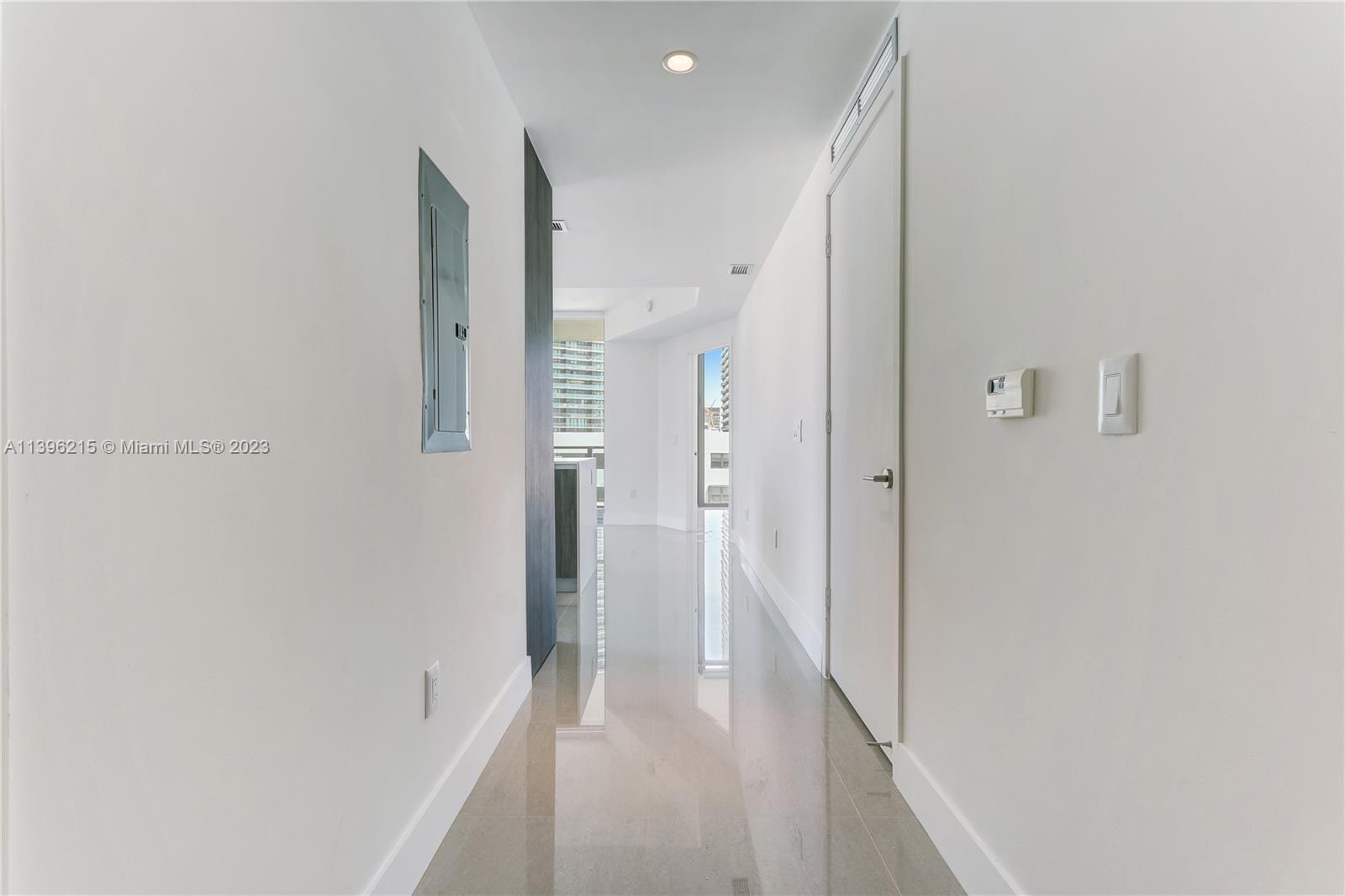 a view of a hallway with a white walls