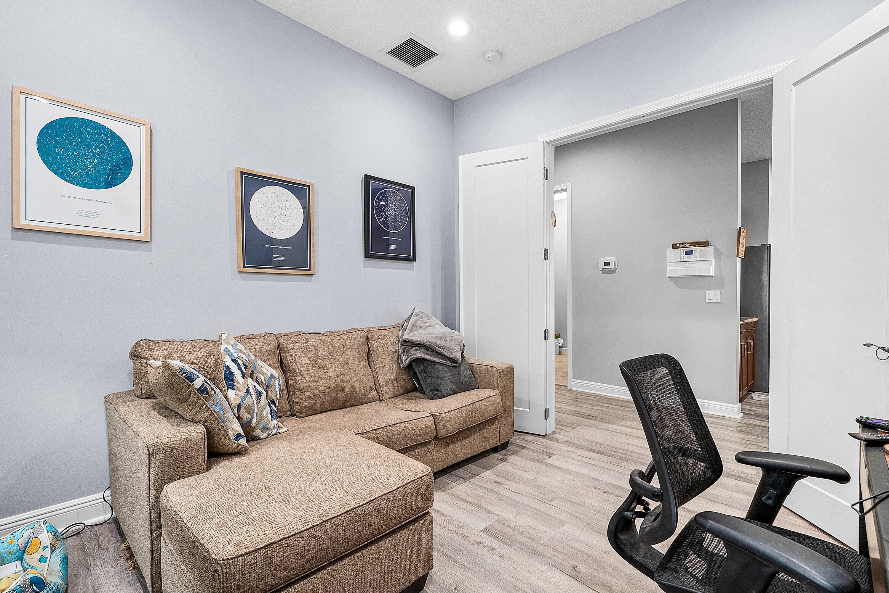 14841 Strand Lane, Unit 14841 Delray Beach, FL 33446 - Photo 26 of 43 a living room with furniture and a chair