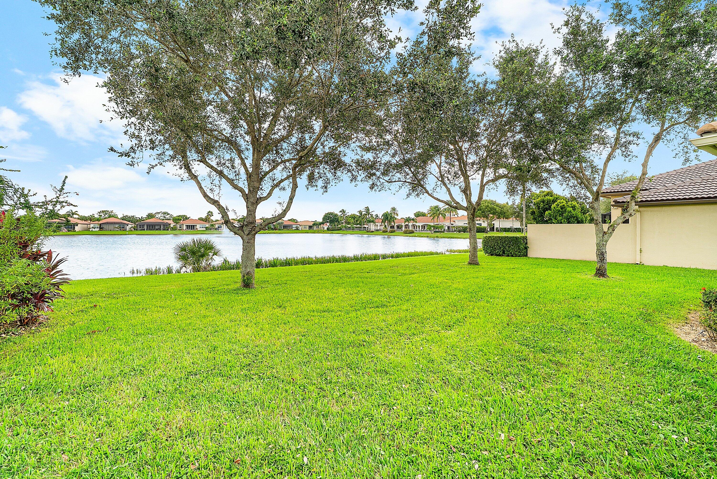 14841 Strand Lane, Unit 14841 Delray Beach, FL 33446 - Photo 32 of 43 a view of yard with tree and green space