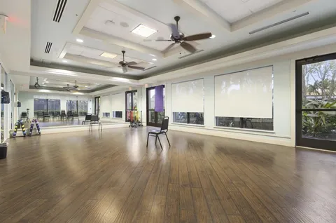 a view of a hall with wooden floor
