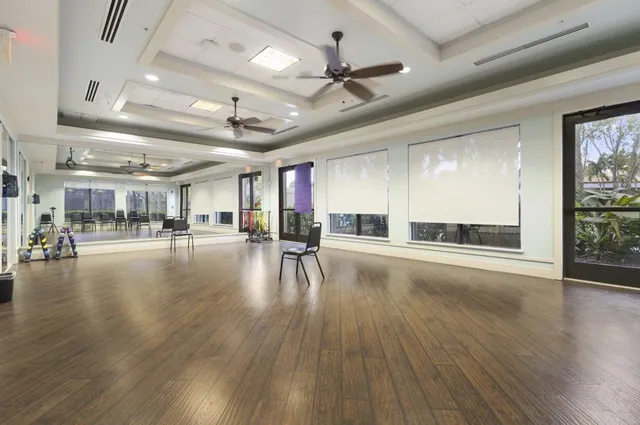 a view of a hall with wooden floor